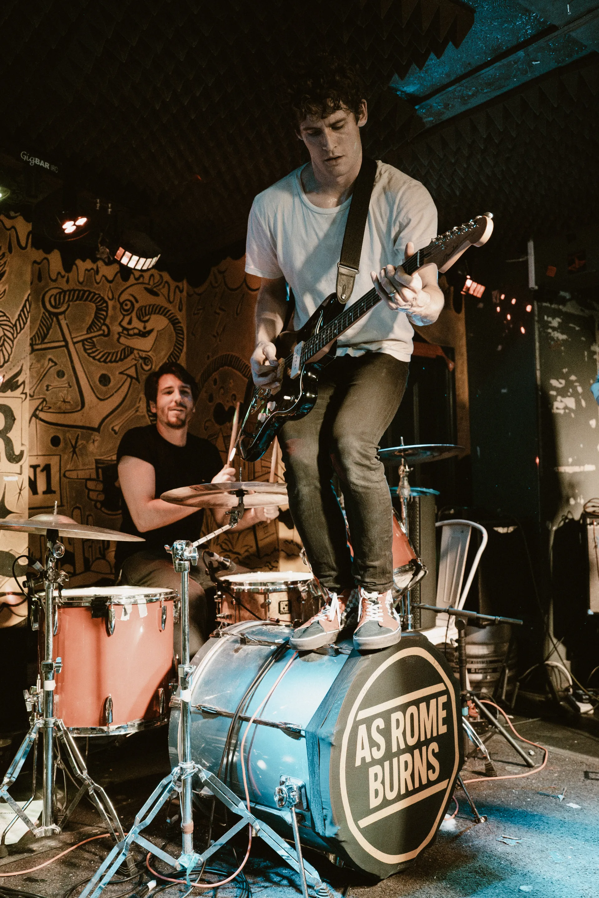David standing on a drum
